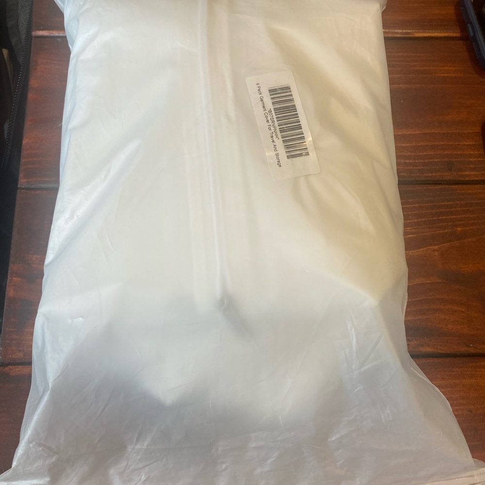 6 white garment bags for travel and storage